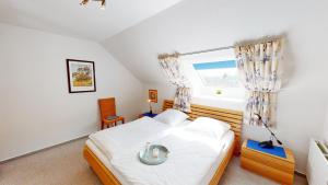 Postel nebo postele na pokoji v ubytování Karpendiek Haus Nr. 37