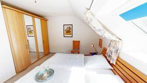 Postel nebo postele na pokoji v ubytování Karpendiek Haus Nr. 37
