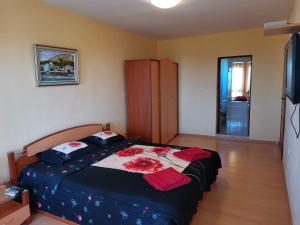 a bedroom with a bed with red towels on it at Villa Holly in Balchik +79 photos