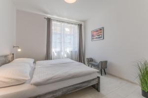 Posteľ alebo postele v izbe v ubytovaní Apartmány Malen