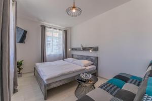 Posteľ alebo postele v izbe v ubytovaní Apartmány Malen