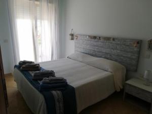 Postel nebo postele na pokoji v ubytování Le Torrette di Anna - Tropea
