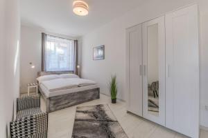 Posteľ alebo postele v izbe v ubytovaní Apartmány Malen