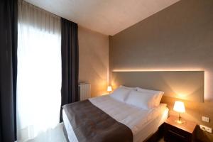 Postel nebo postele na pokoji v ubytování Hotel Majdan