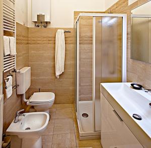 a bathroom with a toilet and a sink and a shower at Golden Eagle in Turin +71 photos