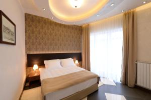 Postel nebo postele na pokoji v ubytování Hotel Majdan