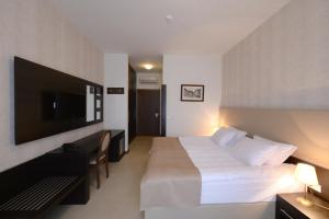 Postel nebo postele na pokoji v ubytování Hotel Majdan