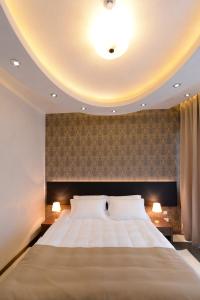 Postel nebo postele na pokoji v ubytování Hotel Majdan