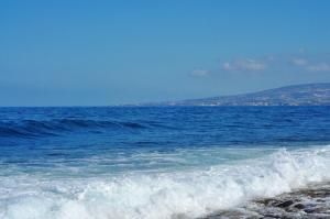 a wave in the ocean on a beach at Mandarinoviy Sad in Gagra