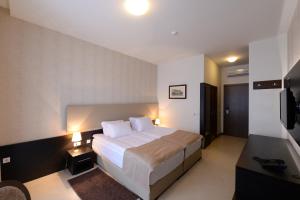 Postel nebo postele na pokoji v ubytování Hotel Majdan