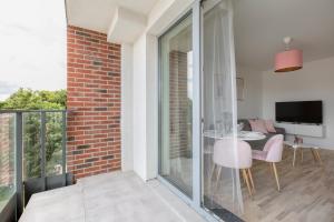 Televízia a/alebo spoločenská miestnosť v ubytovaní Short Stay Apartments