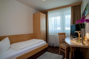 Postel nebo postele na pokoji v ubytování Rumer Hof