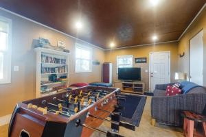 a living room with a large foosball table at The Sandy Spur in Florence