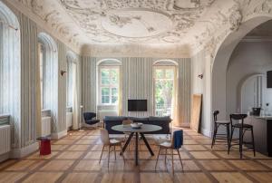 a living room with a table and a couch at Schloss Prossen in Bad Schandau