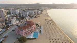 an aerial view of a beach with buildings and the water at Hotel Residence Dune - Free Beach Access in Sunny Beach