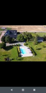 an aerial view of a house with a swimming pool at Ferienhaus Relax in Kösseln
