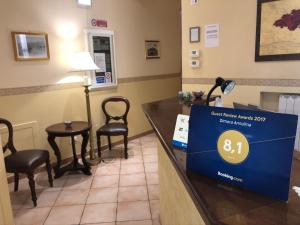 a waiting room at a dental office with a sign on a counter at B&B Dimora Annulina in Palermo