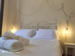 Łóżko lub łóżka w pokoju w obiekcie Villa Blanco's