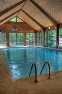 a large swimming pool with two handles in a building at Foxhunt at Sapphire Valley by Capital Vacations in Sapphire