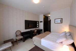 Postel nebo postele na pokoji v ubytování Hotel Majdan