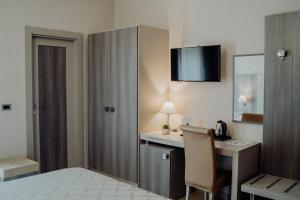 Postel nebo postele na pokoji v ubytování Hotel Niagara