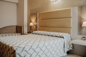 Postel nebo postele na pokoji v ubytování Hotel Niagara