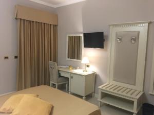 Postel nebo postele na pokoji v ubytování Hotel Niagara