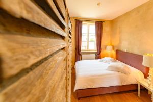Rúm í herbergi á Restauberge Peitry