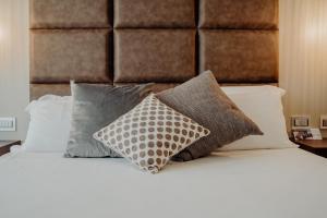 Postel nebo postele na pokoji v ubytování Hotel Niagara