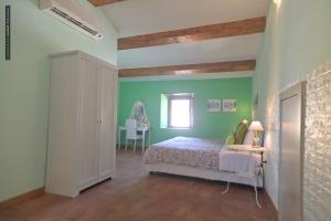 Postel nebo postele na pokoji v ubytování B&B Dimora Paolina