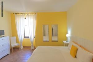 Ένα ή περισσότερα κρεβάτια σε δωμάτιο στο B&B Dimora Paolina