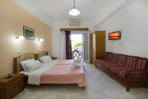 Postel nebo postele na pokoji v ubytování Villa Avra