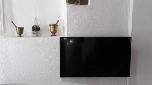 A television and/or entertainment centre at Neoclassical manor house
