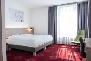 Postel nebo postele na pokoji v ubytování Hotel TAMMEL