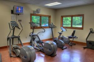 a gym with several exercise bikes in a room at Foxhunt at Sapphire Valley in Sapphire