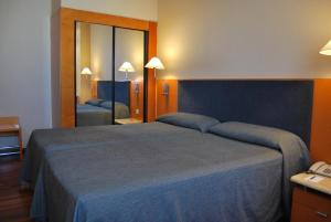 Postel nebo postele na pokoji v ubytování Hotel Villacarlos