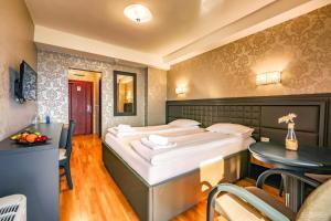 Letto o letti in una camera di Tino Hotel & SPA