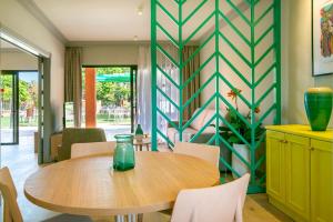 a dining room with a table and chairs at Playa de las Americas Apartments in Playa de las Americas