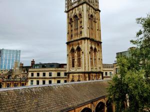 a tall tower with a clock on top of a building at 17 Crusader House in Bristol