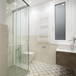 a bathroom with a shower and a toilet and a sink at MARCIAL SUITE Central, modern and NEW. in San Sebastián