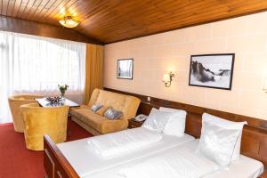 Ένα ή περισσότερα κρεβάτια σε δωμάτιο στο Hotel Berghof Graml