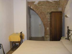 Postel nebo postele na pokoji v ubytování Albergo Cannon d'Oro