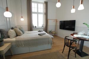 Televízia a/alebo spoločenská miestnosť v ubytovaní Gellerico Apartments Deák Square
