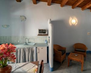 a kitchen with a sink and a counter top at Solares Case Vacanze in Ustica