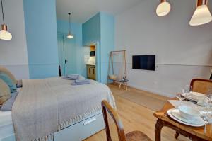Televízia a/alebo spoločenská miestnosť v ubytovaní Gellerico Apartments Deák Square