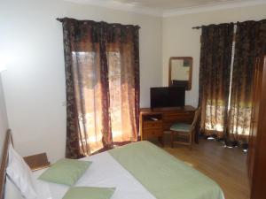 Postel nebo postele na pokoji v ubytování Hotel Bonjardim