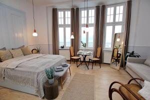 Posteľ alebo postele v izbe v ubytovaní Gellerico Apartments Deák Square