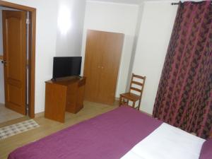 Postel nebo postele na pokoji v ubytování Hotel Bonjardim