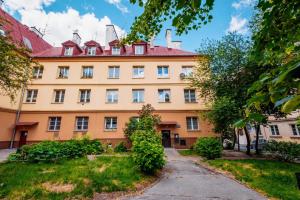 an orange building with a red roof at KOZAcki Kwadrat in Lublin