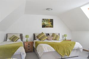 Ένα ή περισσότερα κρεβάτια σε δωμάτιο στο Auburn Cottage